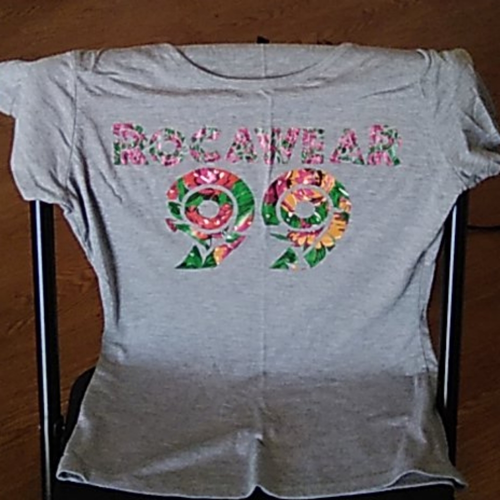 Gray T-shirt. Colorful design on front.